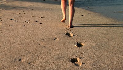 stock-footage-woman-walking-along-the-beach-big-island-hawaii.jpg